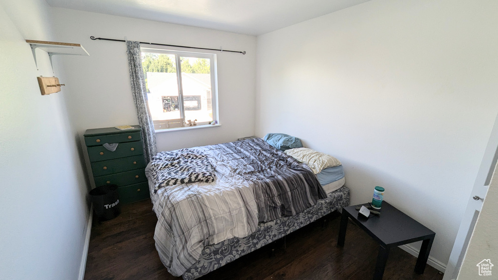 Bedroom featuring dark wood-type flooring