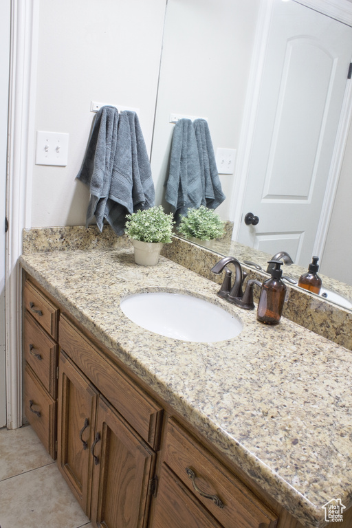 Bathroom featuring vanity and tile patterned floors