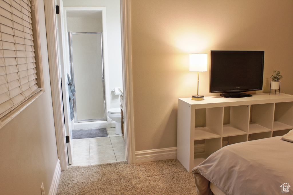 Carpeted bedroom with ensuite bath