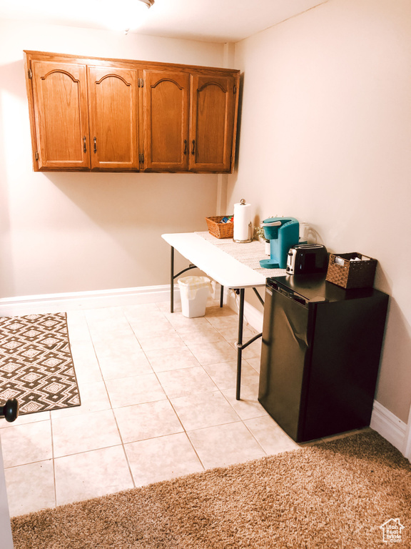 Home office featuring light tile patterned floors