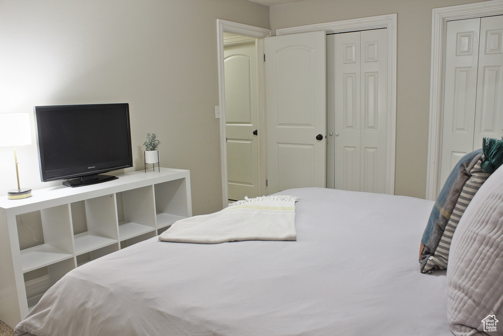 Bedroom featuring multiple closets