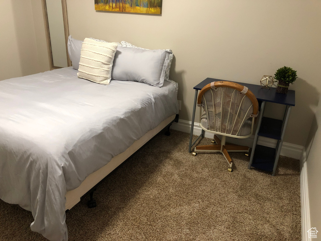 Bedroom featuring carpet flooring