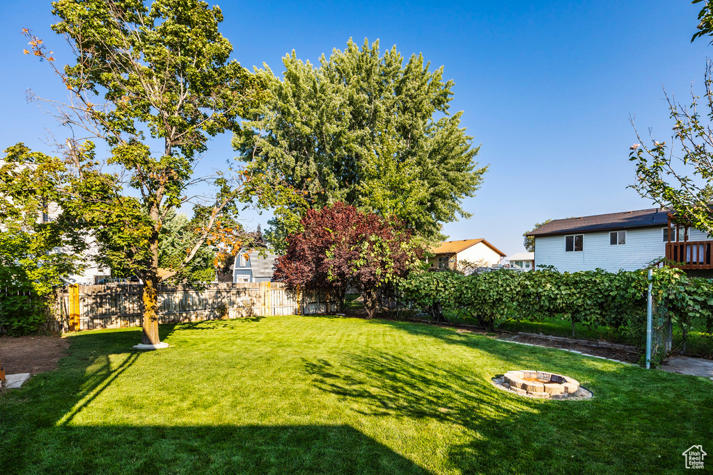 View of yard featuring a fire pit