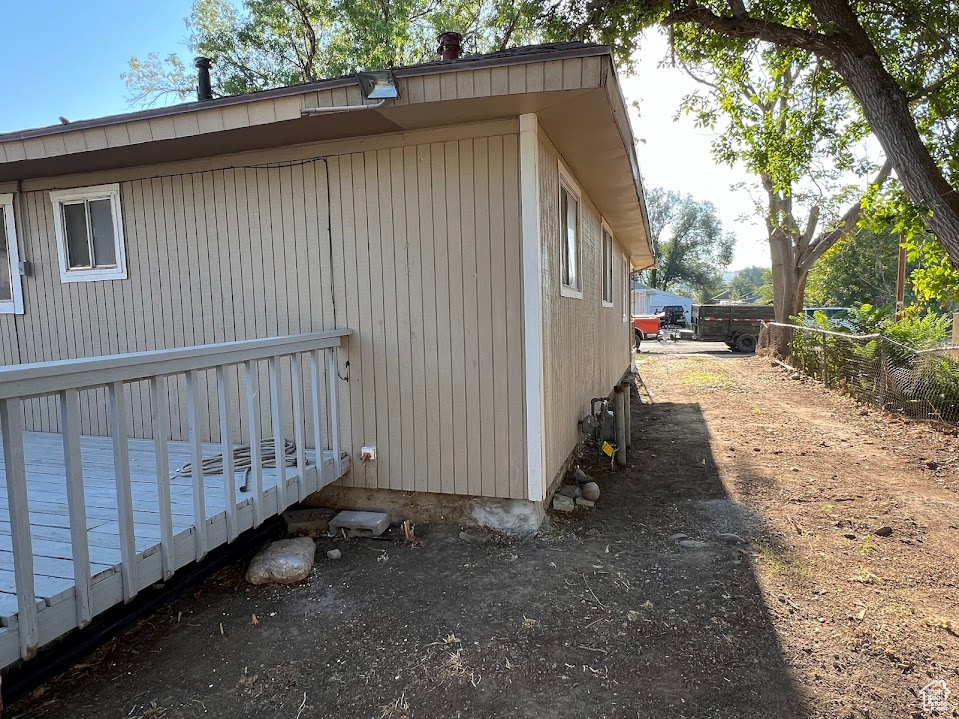 View of property exterior with a deck