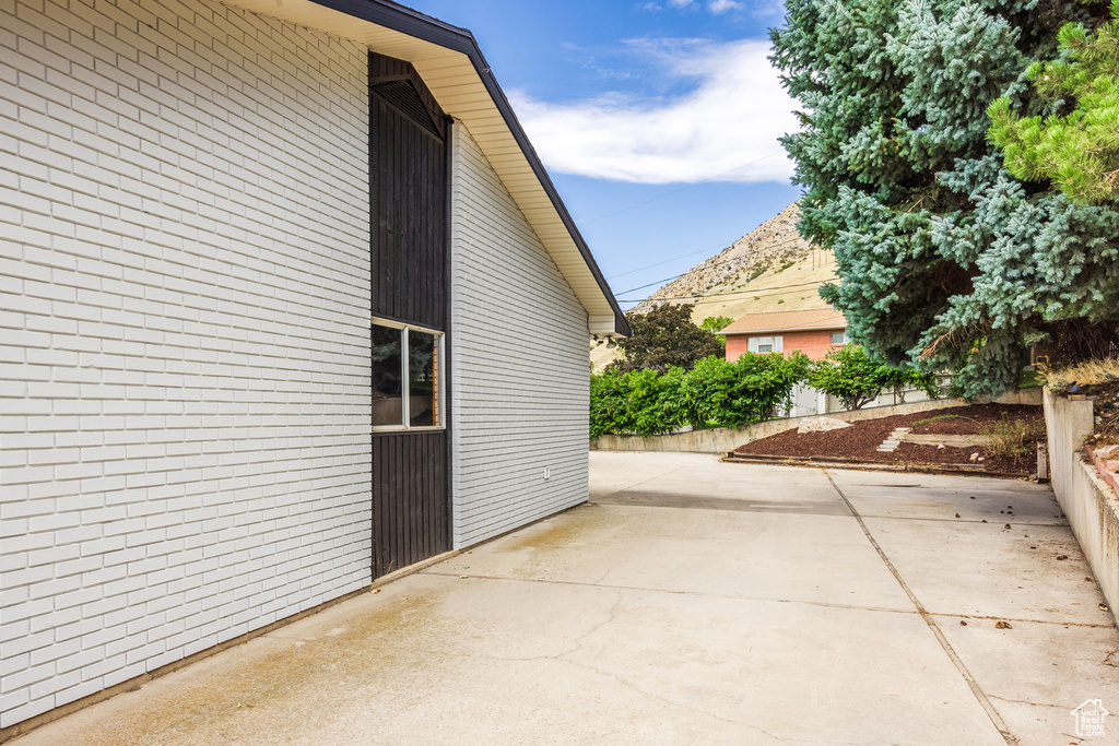 View of property exterior featuring a patio