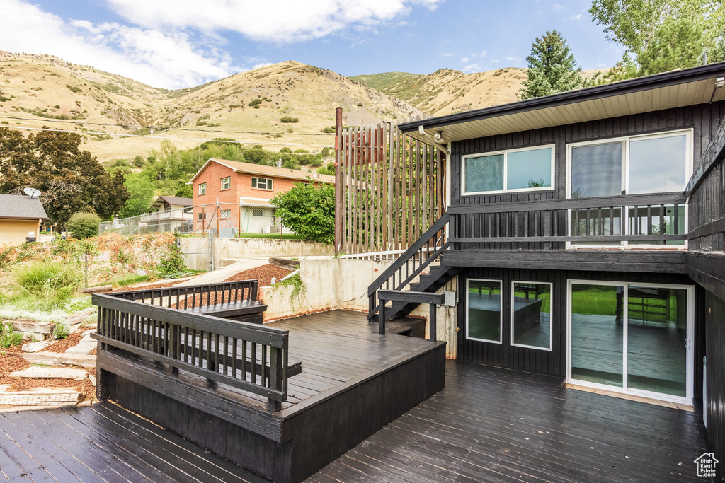 Wooden terrace featuring a mountain view