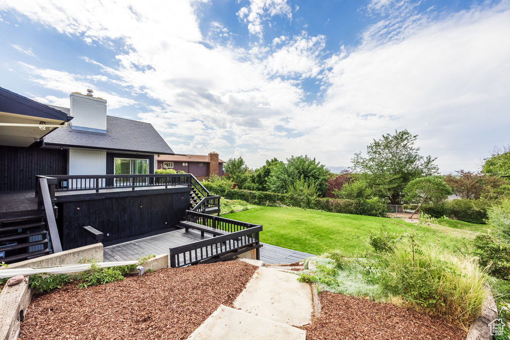 View of yard with a wooden deck