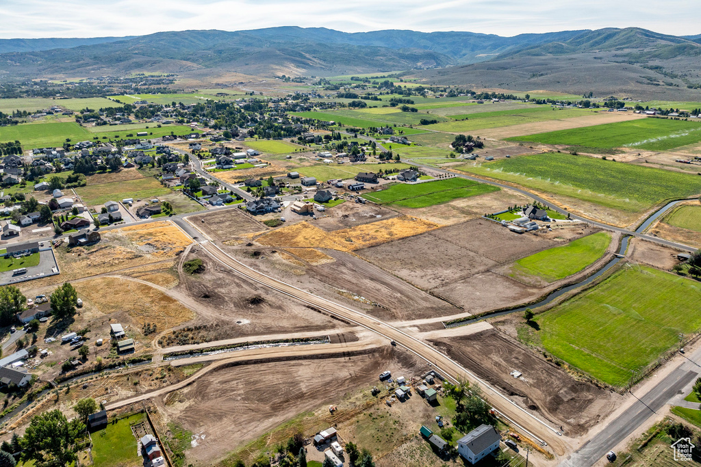 Birds eye view of property with a mountain view and a rural view