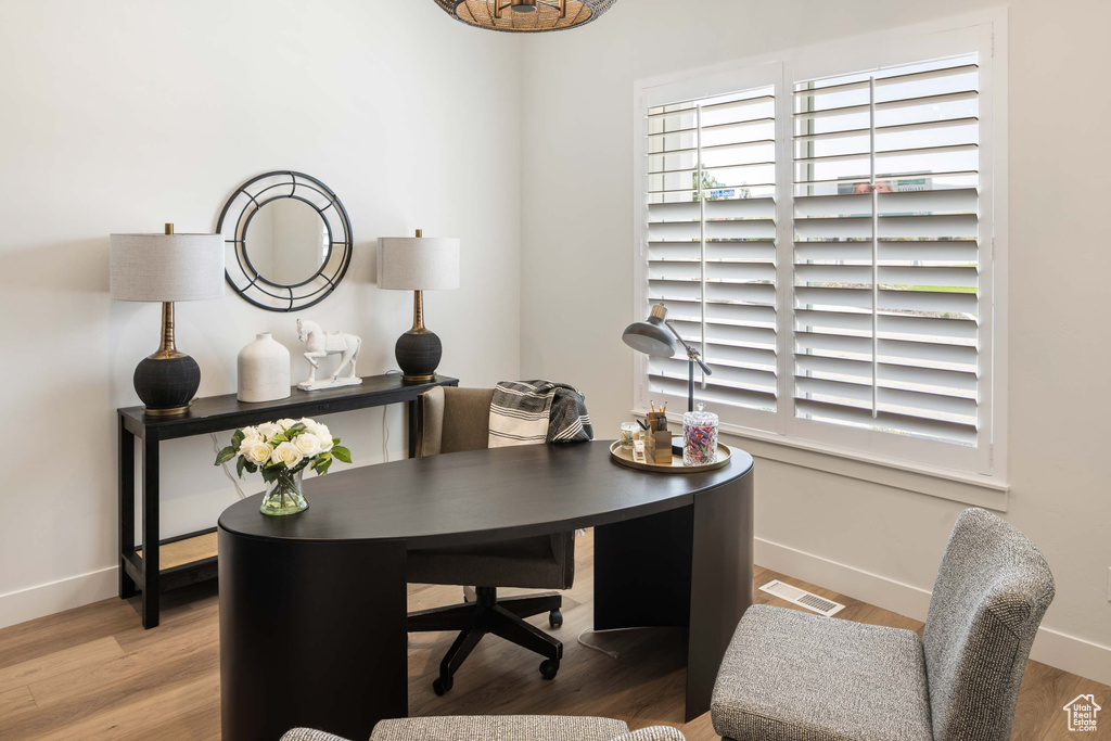 Office space featuring hardwood / wood-style floors