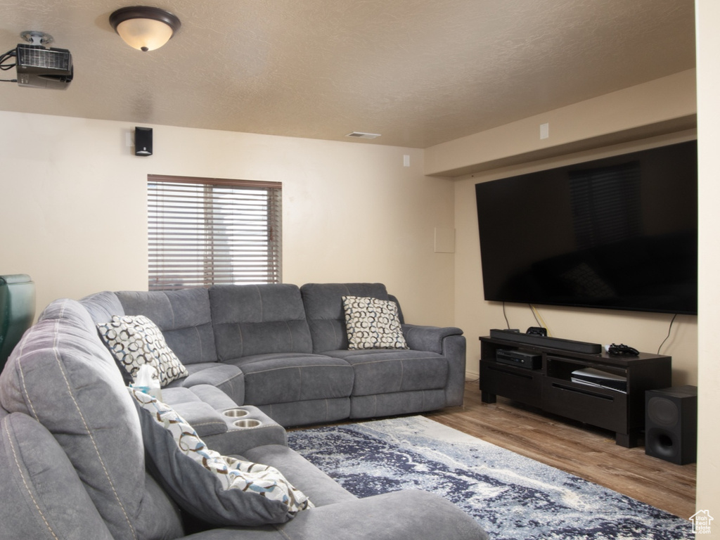 Living room with hardwood / wood-style flooring