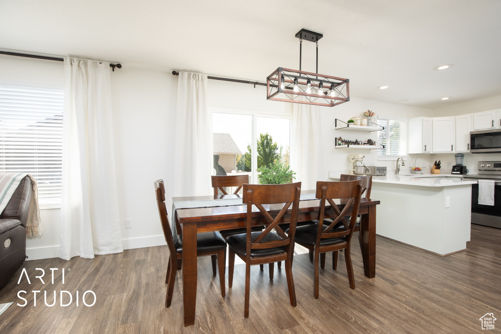 Dining space featuring hardwood / wood-style floors and sink