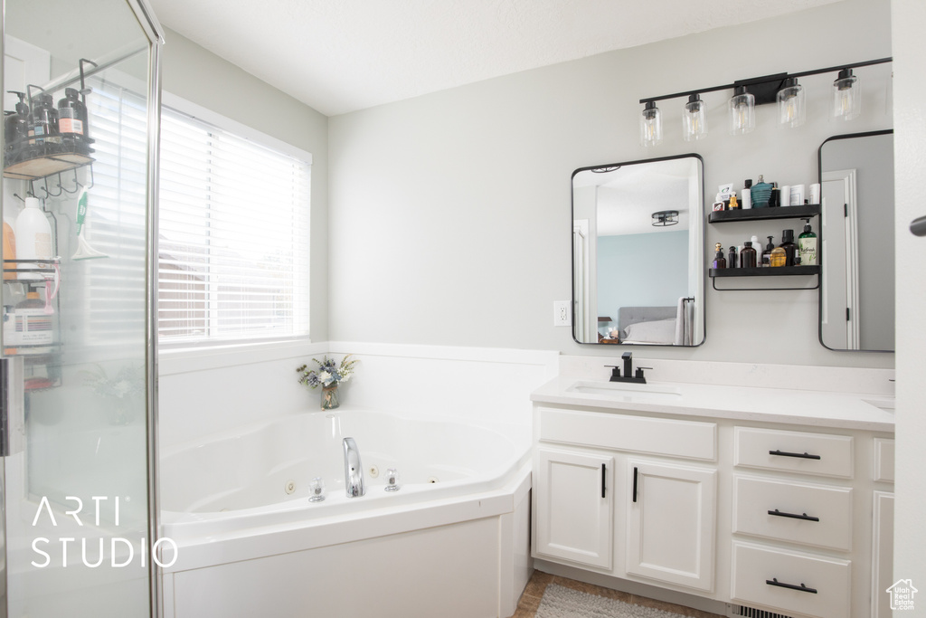 Bathroom with vanity and independent shower and bath