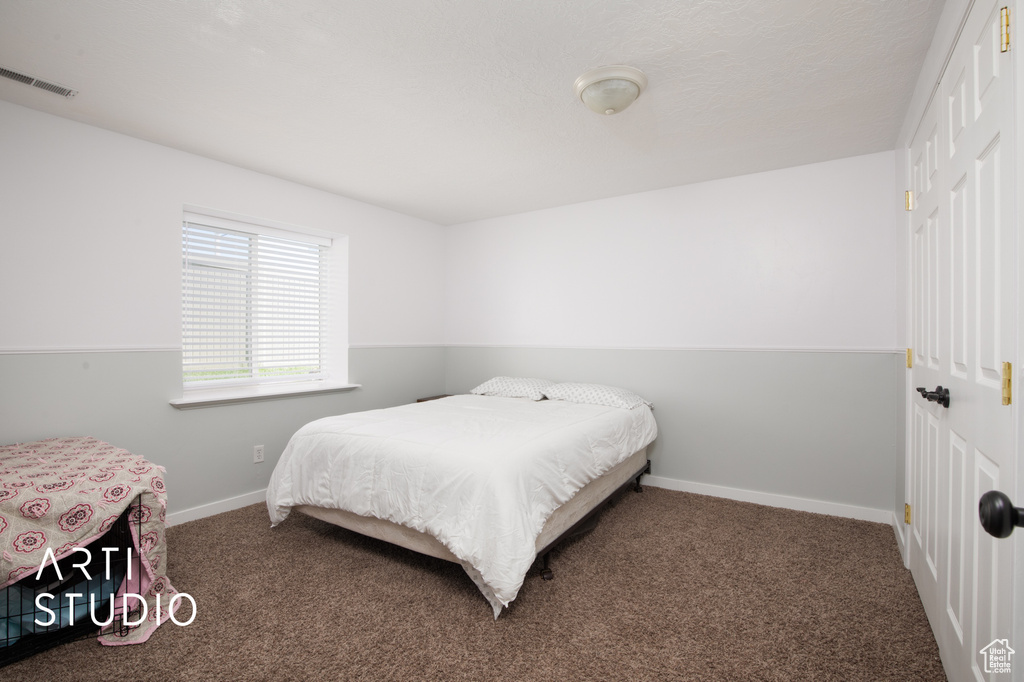 Bedroom featuring carpet flooring