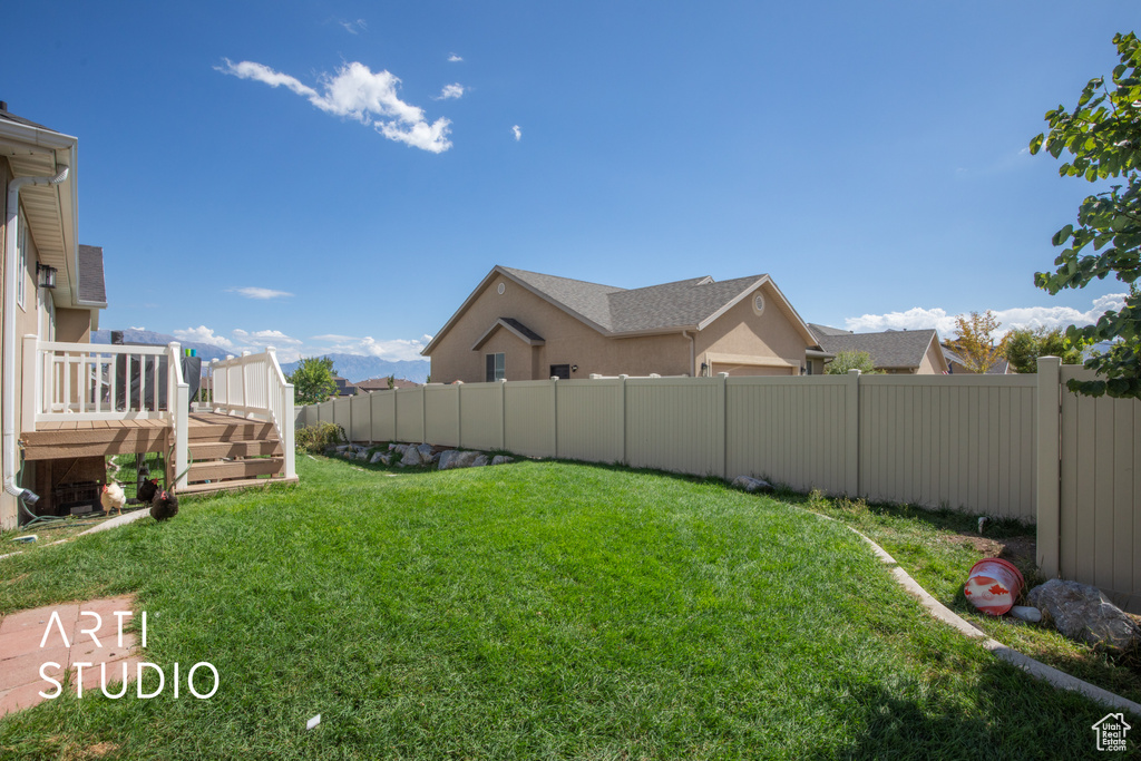 View of yard featuring a deck