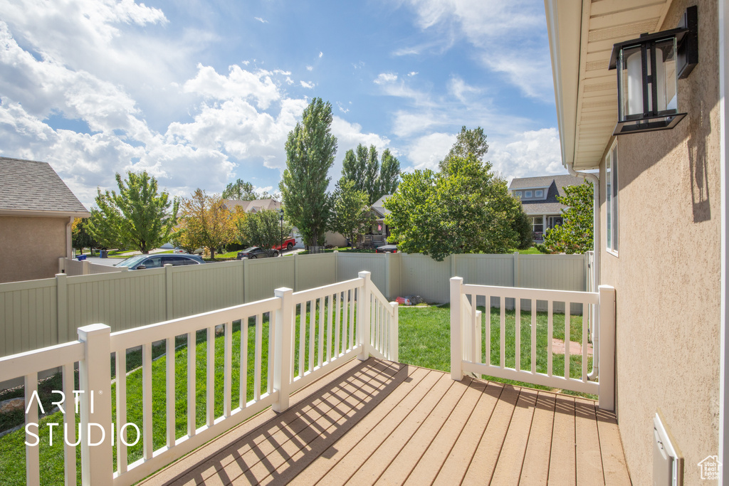 Wooden terrace with a lawn