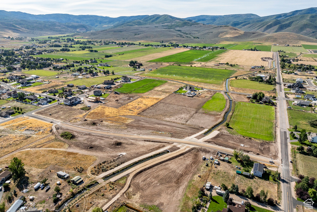 Drone / aerial view with a mountain view and a rural view