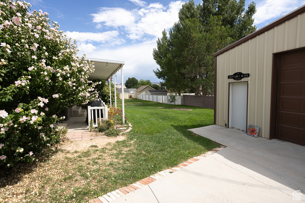 View of yard featuring a garage