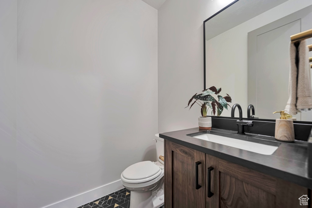 Bathroom featuring vanity and toilet