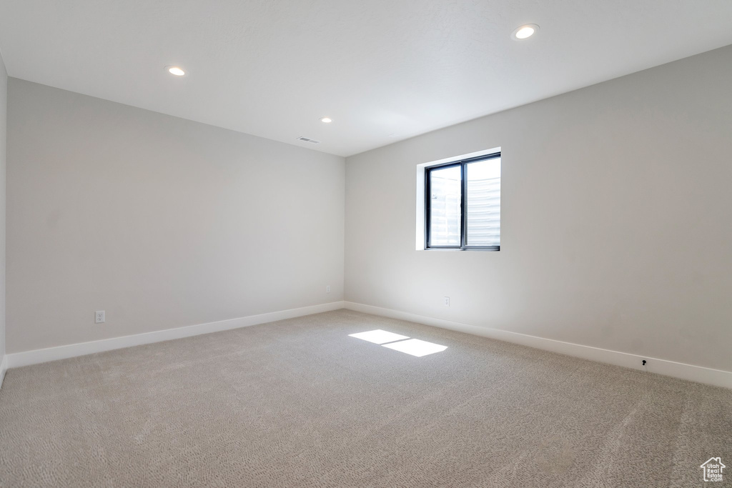 View of carpeted spare room