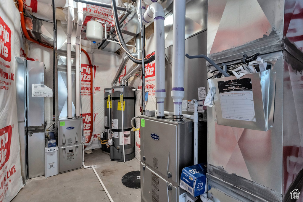 Utility room with strapped water heater