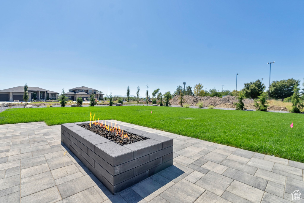 View of patio / terrace with an outdoor fire pit