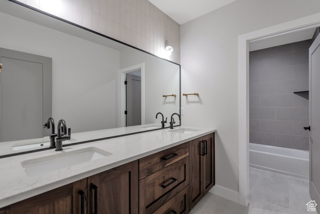 Bathroom with tile patterned flooring and vanity