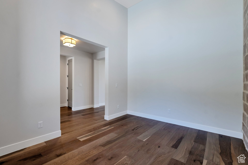 Spare room featuring dark hardwood / wood-style floors