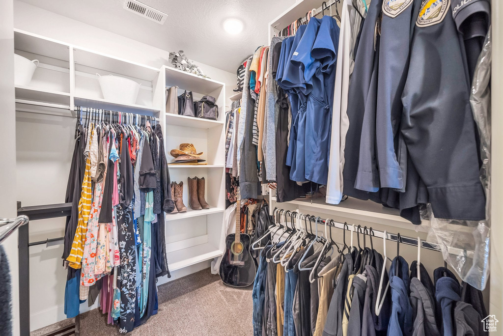 Walk in closet with carpet