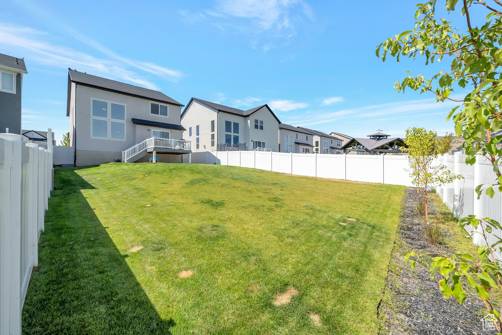 View of yard featuring a wooden deck