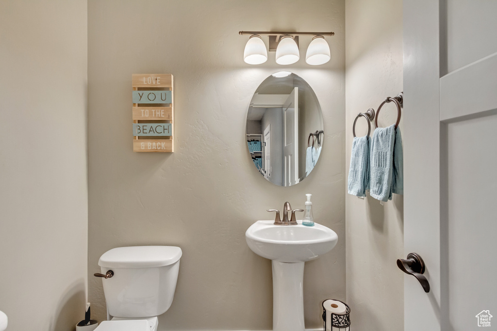 Bathroom with toilet and sink