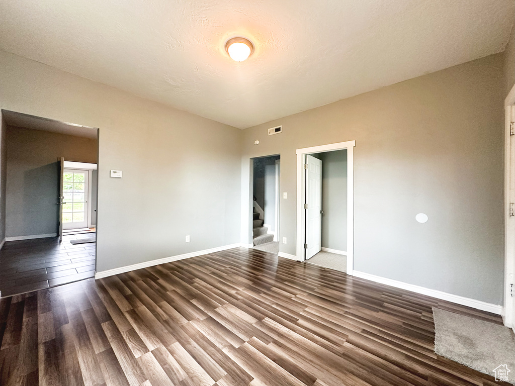 Empty room featuring hardwood / wood-style flooring