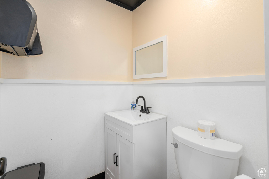 Bathroom featuring vanity and toilet