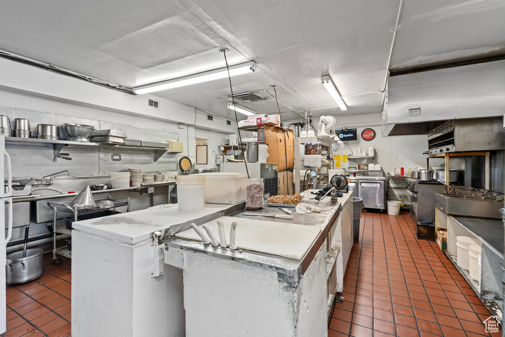 Kitchen featuring tile patterned flooring and washer / clothes dryer