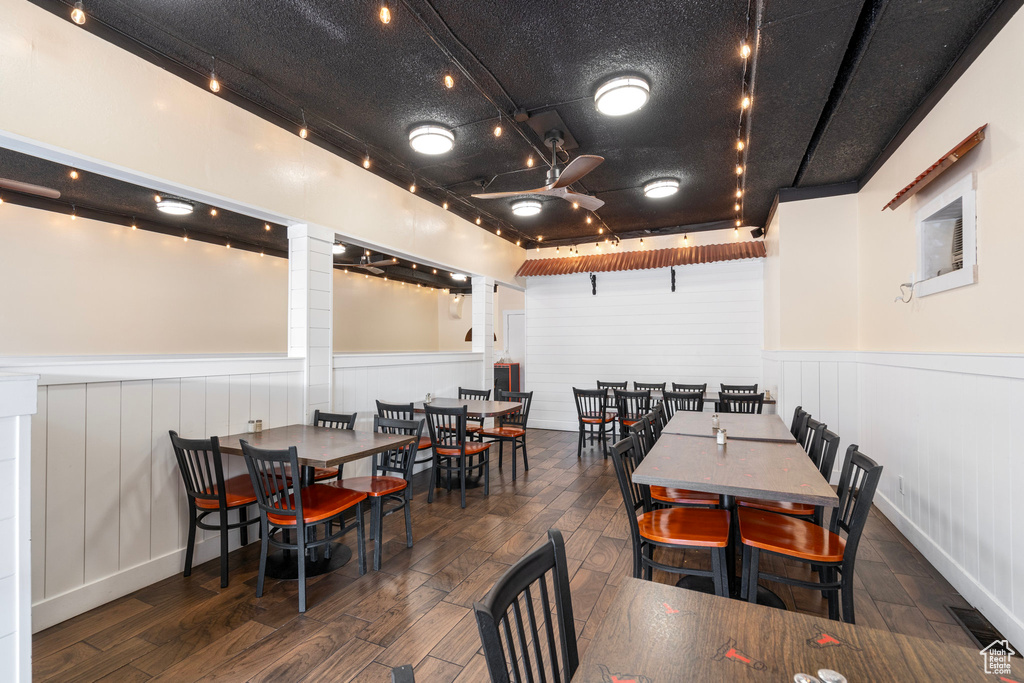 Dining room featuring dark wood-type flooring