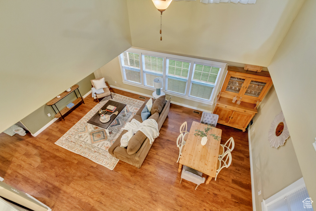 Living room featuring lofted ceiling and wood-type flooring