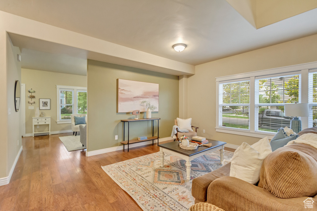 Living room with hardwood / wood-style flooring