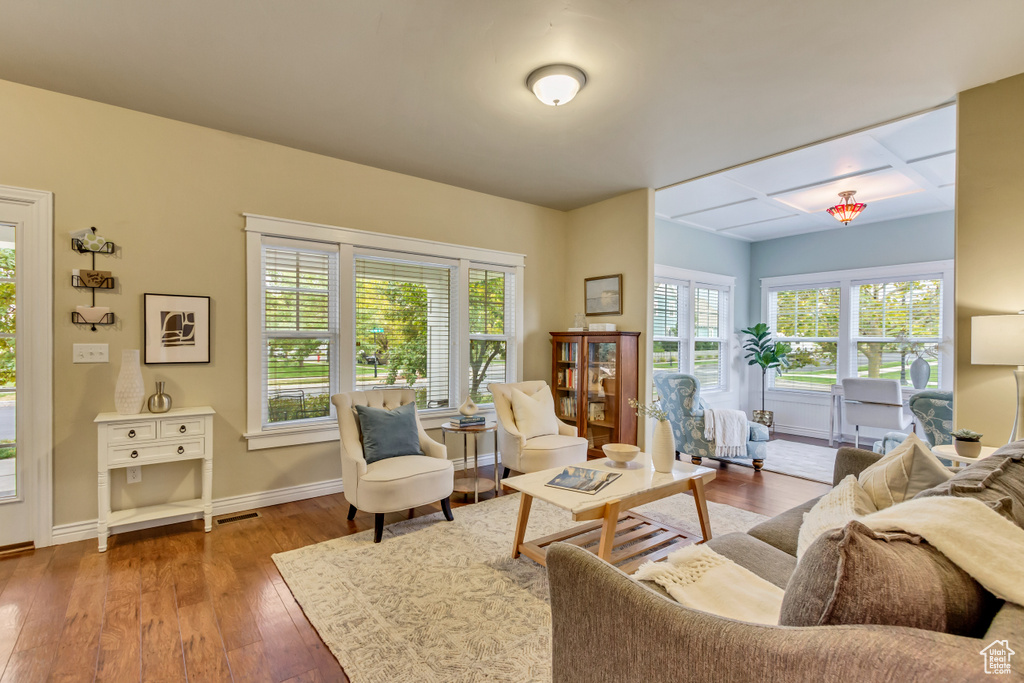 Living room with hardwood / wood-style flooring