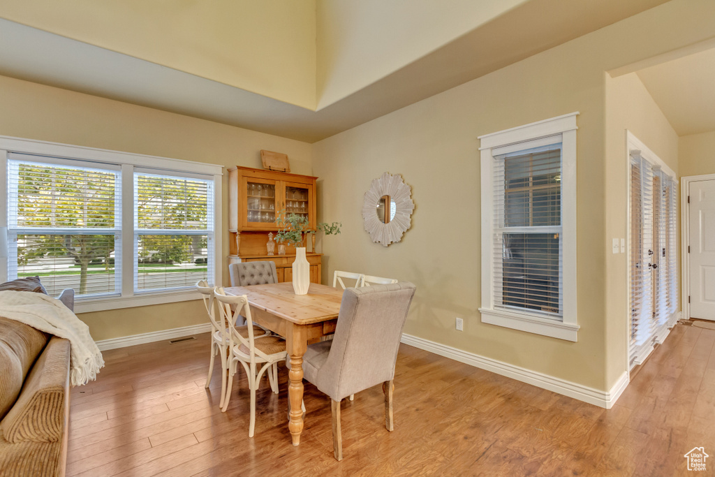 Dining space with light wood-type flooring