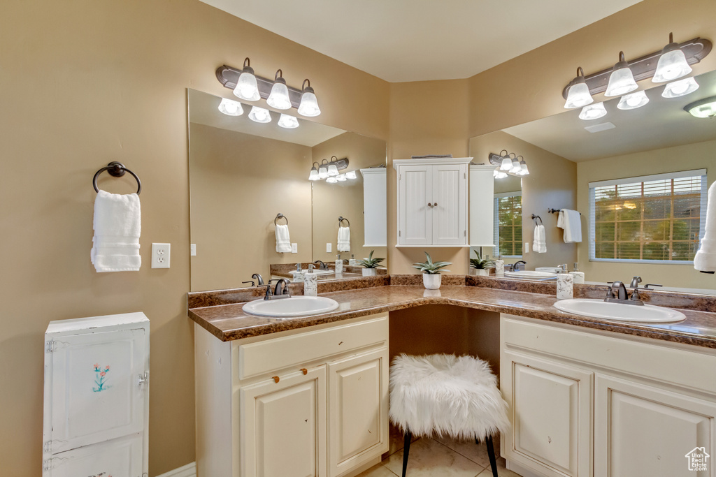 Bathroom with vanity and tile patterned flooring