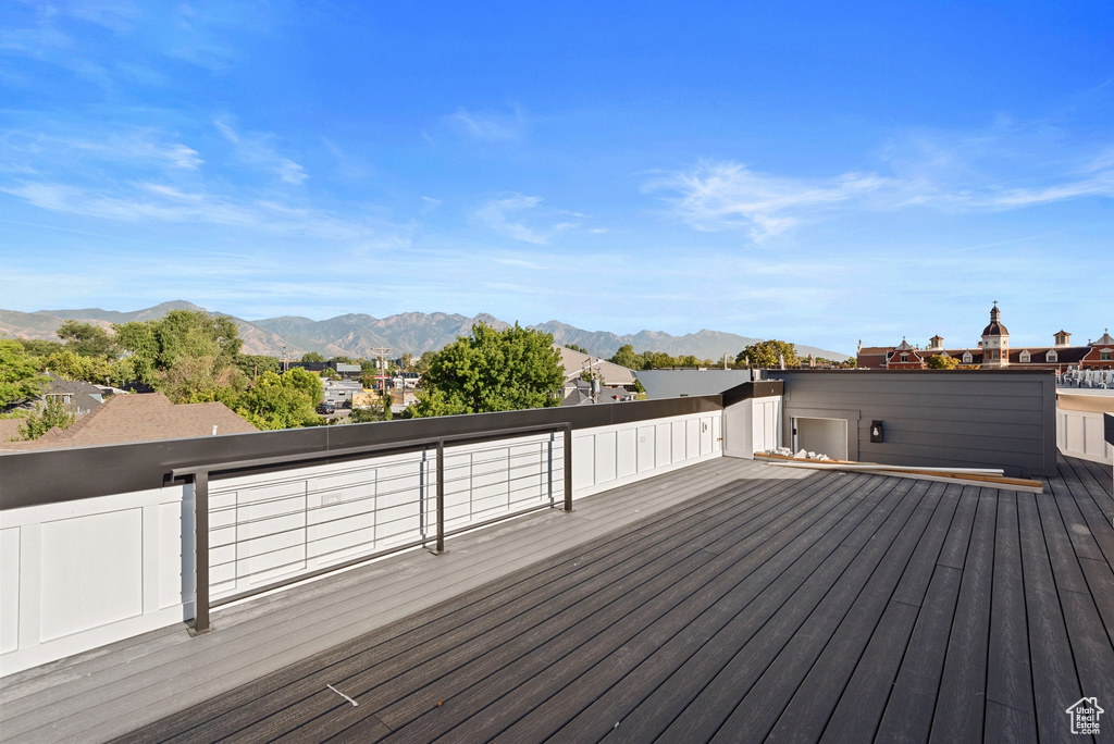 Wooden terrace featuring a mountain view