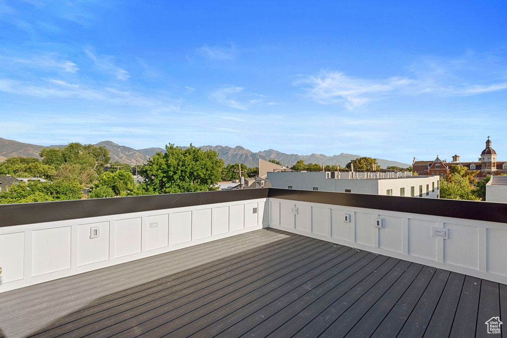 Wooden deck featuring a mountain view