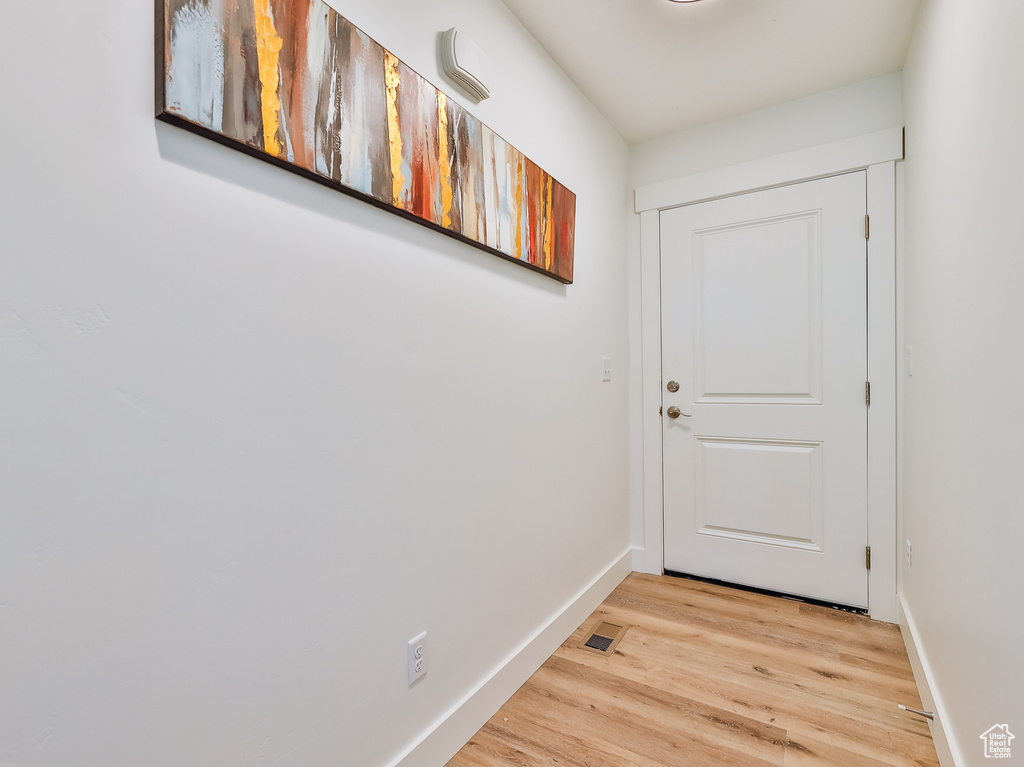 Doorway to outside featuring light wood-type flooring