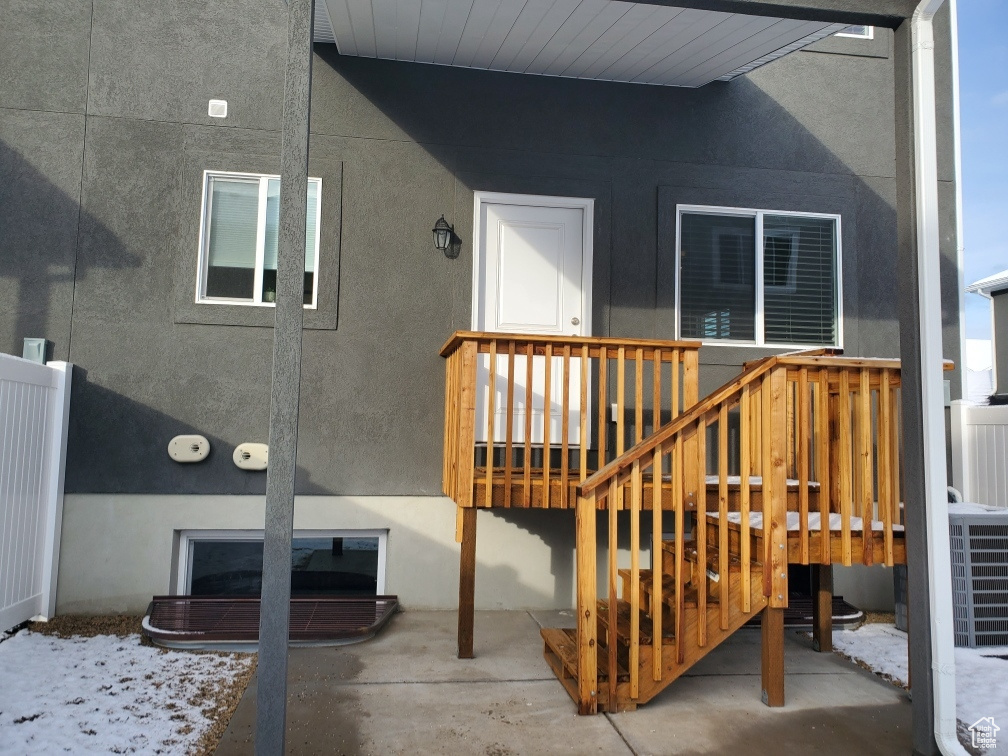 Property entrance with stucco siding