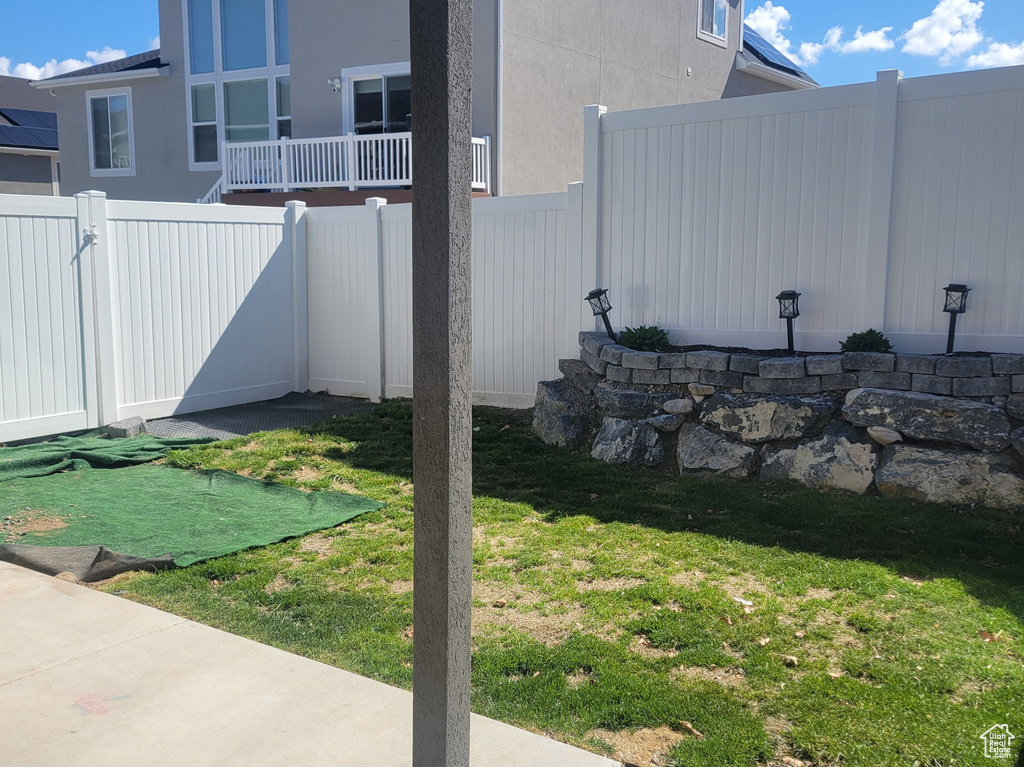 View of yard featuring a fenced backyard and a patio area