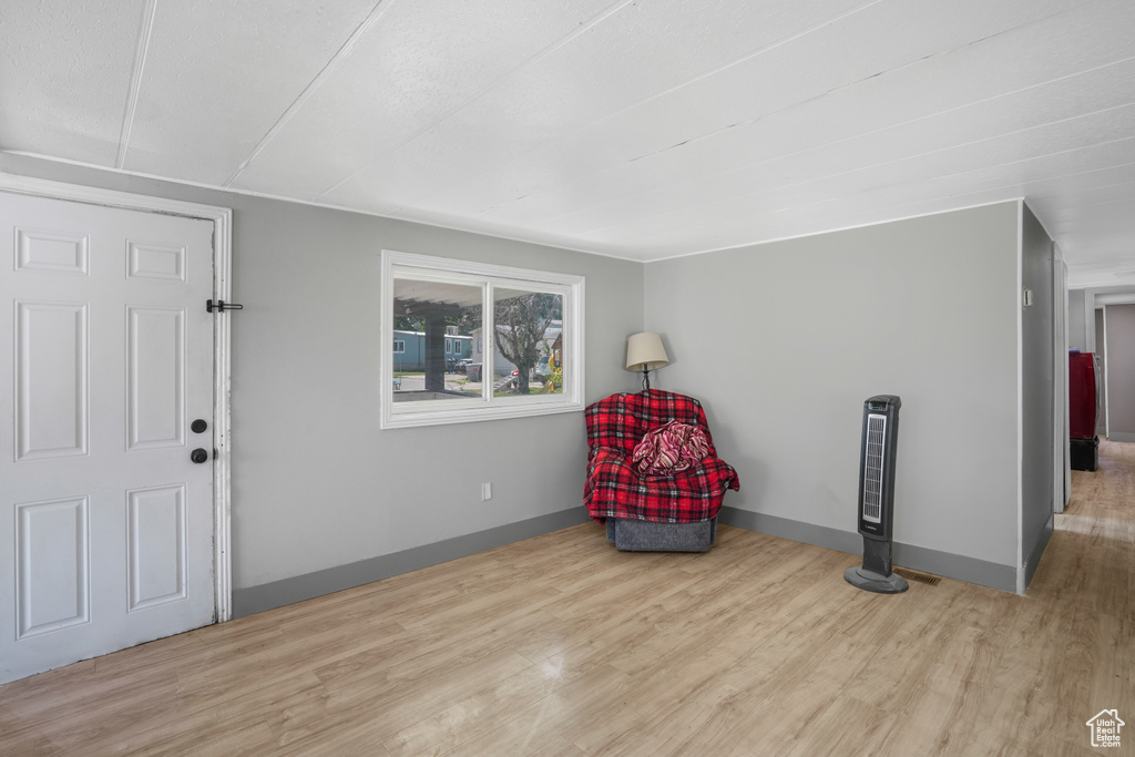 Living area with light wood-type flooring