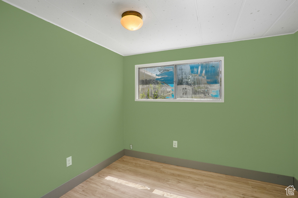 Unfurnished room featuring hardwood / wood-style floors