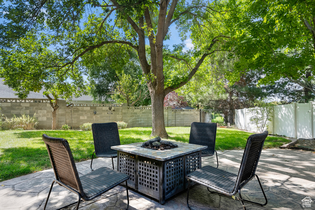 View of patio / terrace with an outdoor fire pit