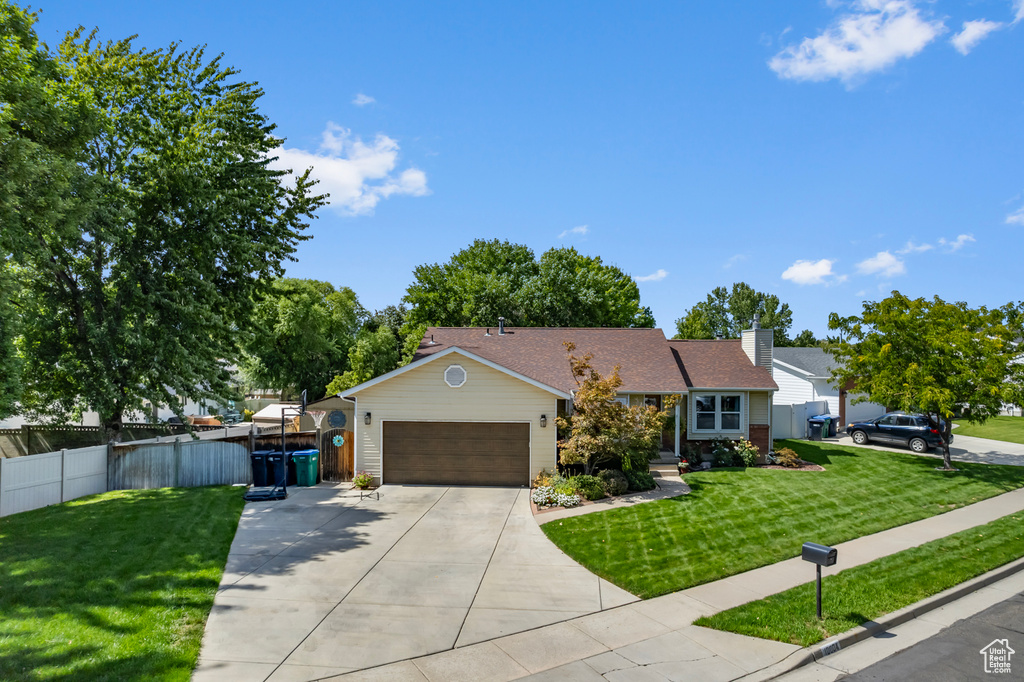 Ranch-style home with a front lawn