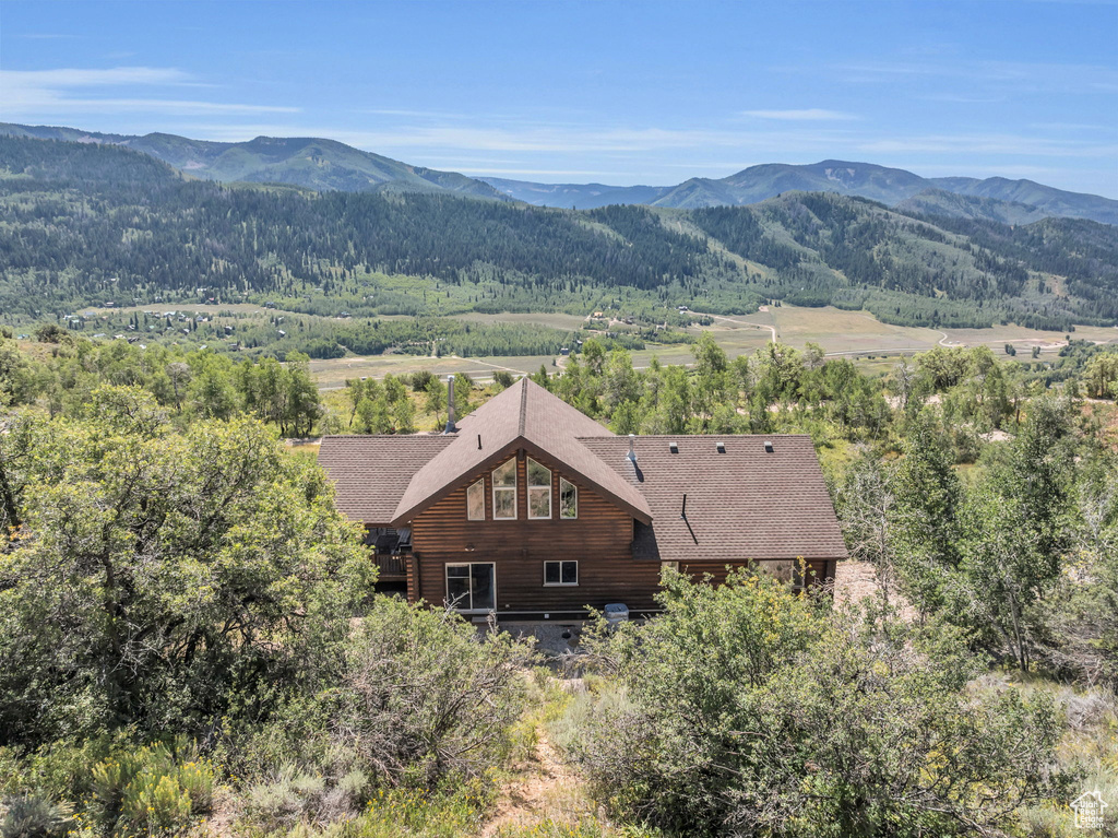 Birds eye view of property featuring a mountain view