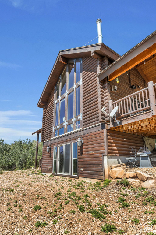 View of side of property with a deck